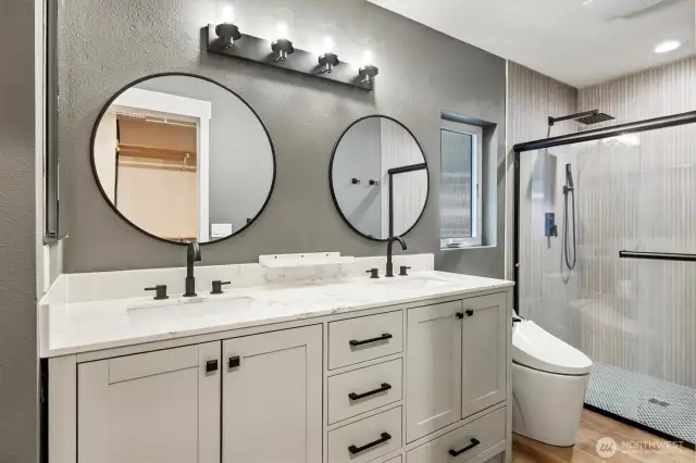 Full bath featuring modern finishes and a stunning tile shower and heated flooring!