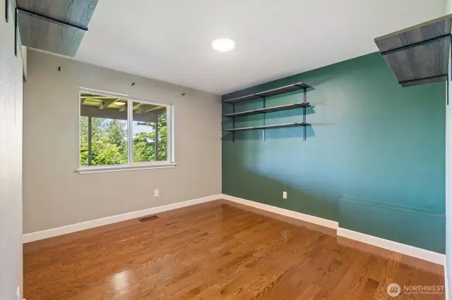 Spacious downstairs bedroom with natural light.