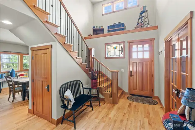 A peek back to the entrance, the gorgeous doors and a glimpse into the dining room