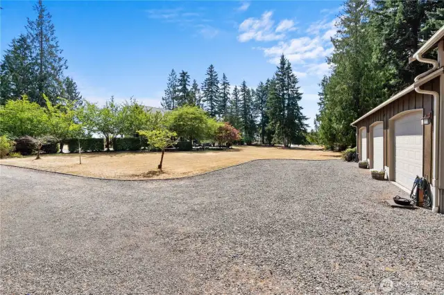 Nice wide driveway to the shop great for turning around.  Enough space from the home for a hobbybist to work on cars, woodwork or simply have a recreational space.