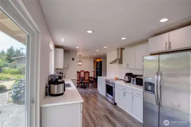 Slider to kitchen opens to back yard great for entertaining and outdoor dining in the private oasis.