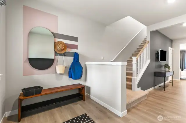 Large foyer perfect for a bench or coat rack. Actual home is under construction and finishes, materials, and colors will vary. See site agent for details.