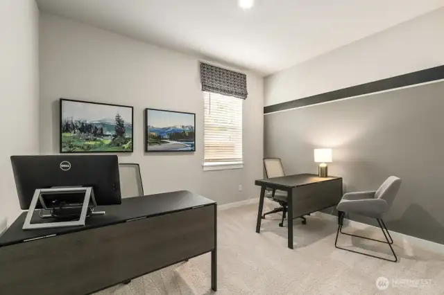 Main floor bedroom for sleep or office space. Actual home is under construction and finishes, materials, and colors will vary. See site agent for details.
