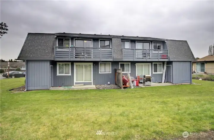 Backside with decks, patios and yard