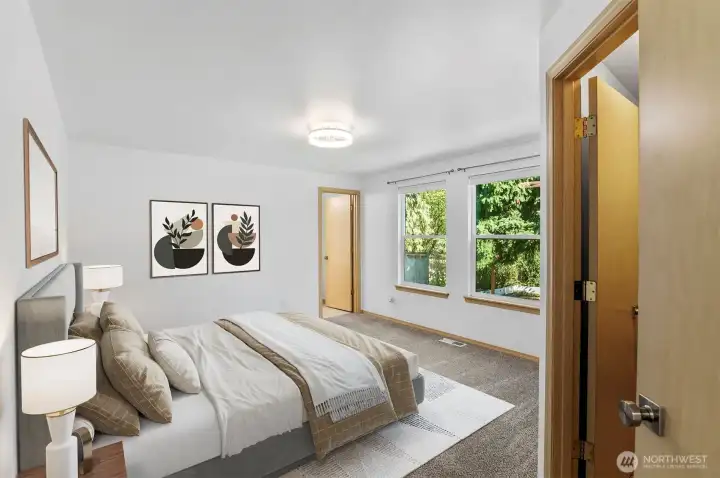 Bright and spacious retreat with plenty of room for a king bed and sitting area. (Virtually Staged )