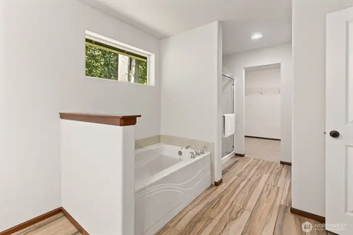 Primary Bath w/soaking tub and separate shower.