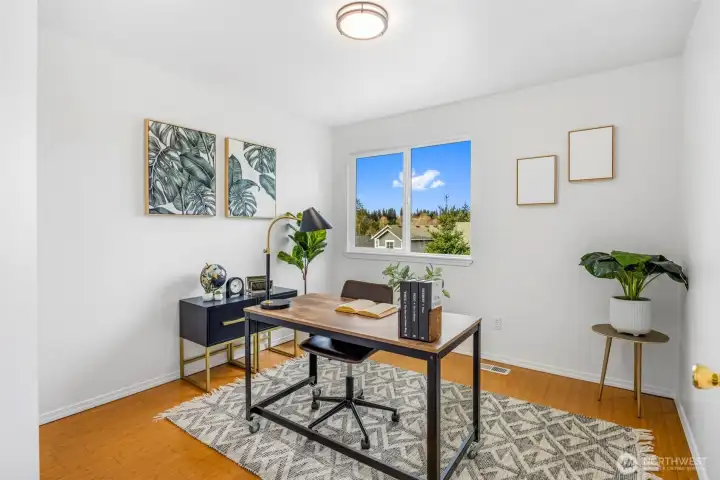 This flexible upper-level room works beautifully as a home office or bedroom.