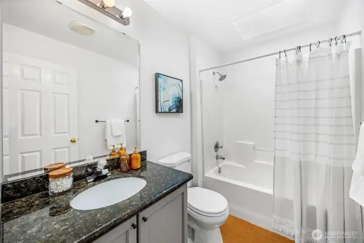 The full bathroom on the upper level serves the secondary bedrooms.