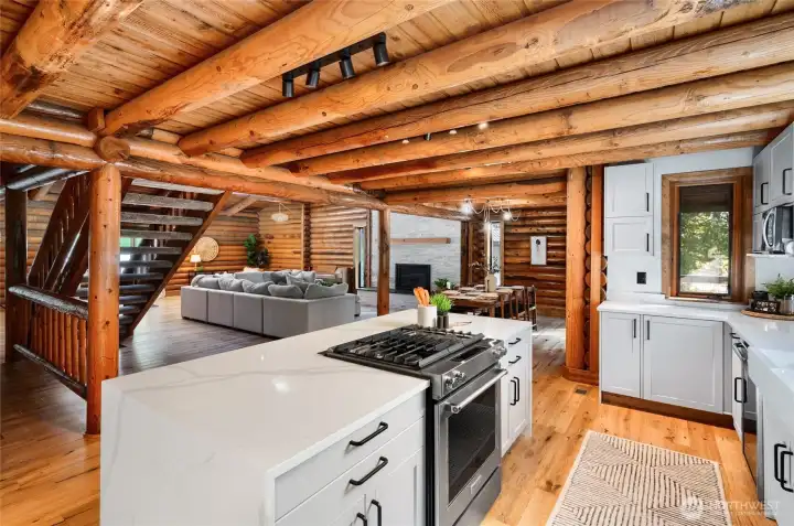 Quartz counters and waterfall edge island.