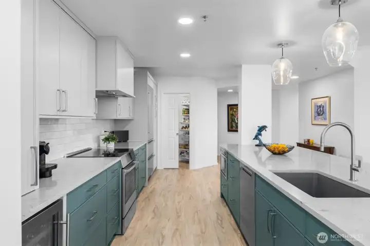 Fully remodeled kitchen with modern cabinetry, premium finishes, and stainless steel appliances.