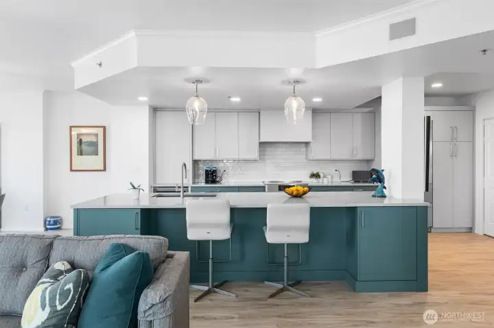 Updated kitchen designed for functionality and style in downtown Bellevue high-rise condo.