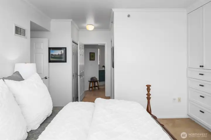 Spacious primary suite in Bellevue Pacific Tower with abundant natural light.