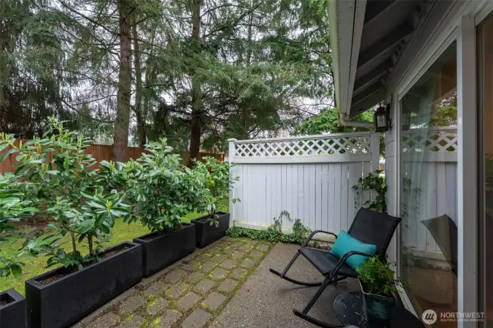 This end-unit townhouse offers extra privacy and is nestled in a serene, park-like setting.