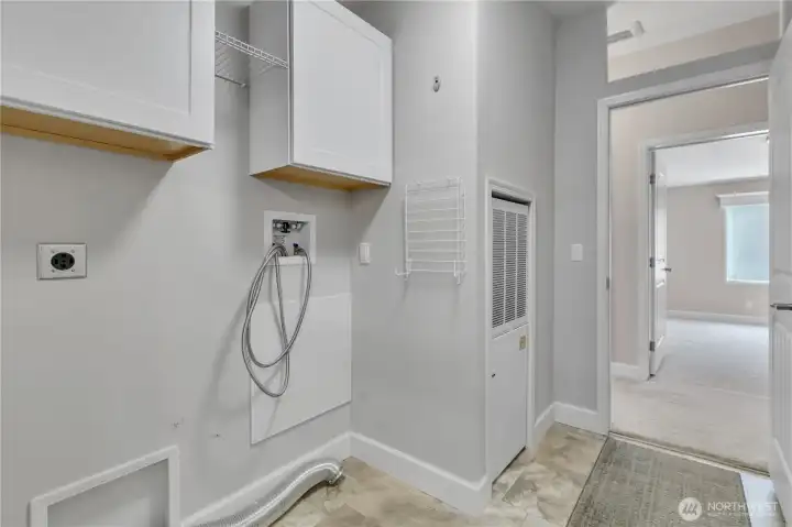 Utility room with washer/dryer hook-ups