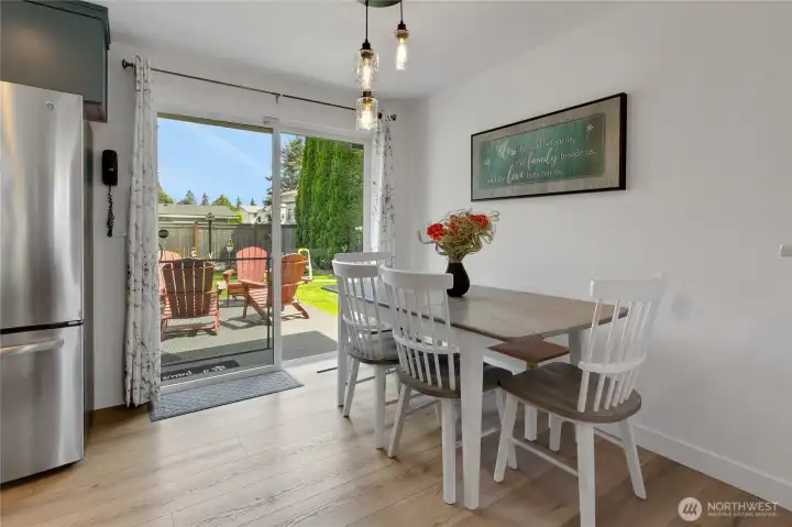 Dining room just off from the kitchen, to enjoy a meal with a view of your tranquil back yard!