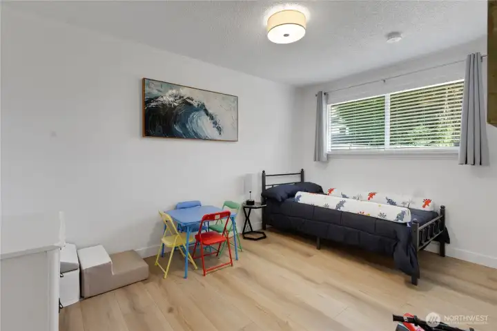 Bedroom 2 is right next door, with plenty of space, warm tones, an abundance of light and a view of the backyard!