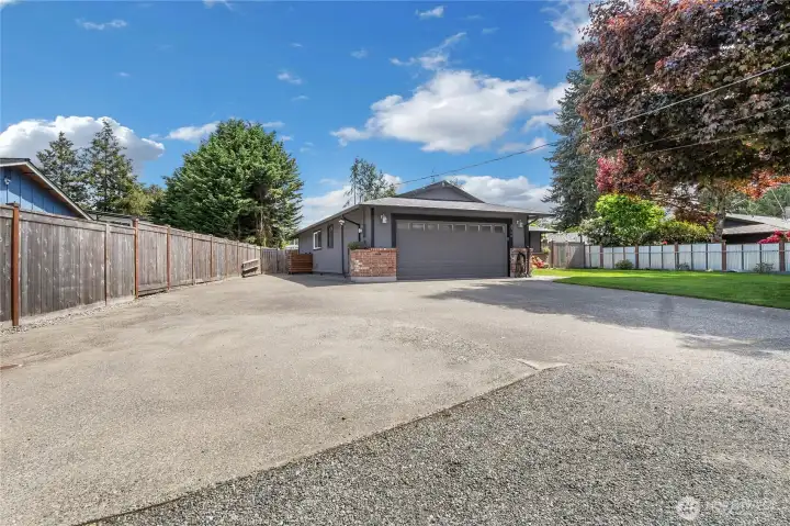 Large RV parking space, home is wired for a generator, this property has RV charging and a built-in EV charging station!
