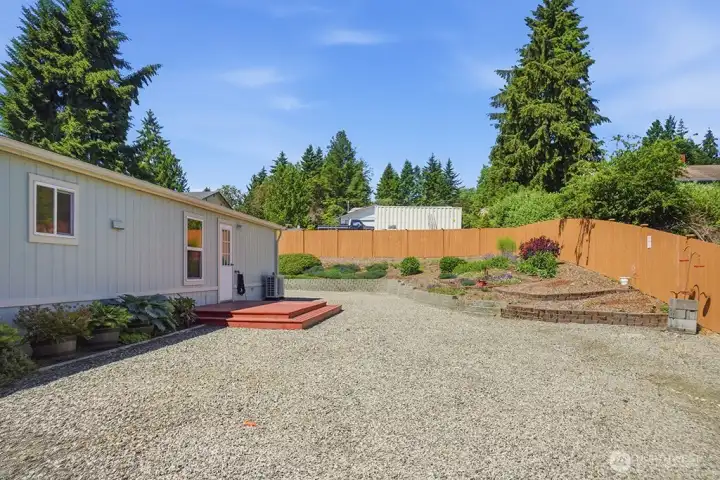 side yard with back door into laundry toom