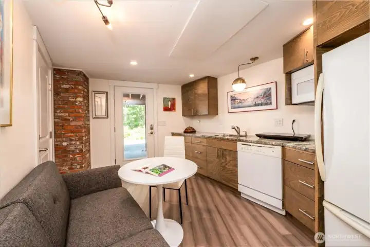 Lower-level kitchen, dining, and living area. Lower-level kitchen, dining, and living area.