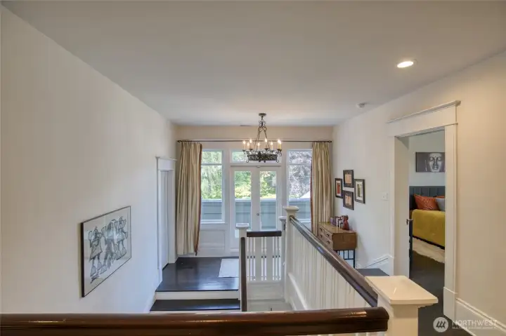 Stairway landing to second floor and balcony Stairway landing to second floor and balcony