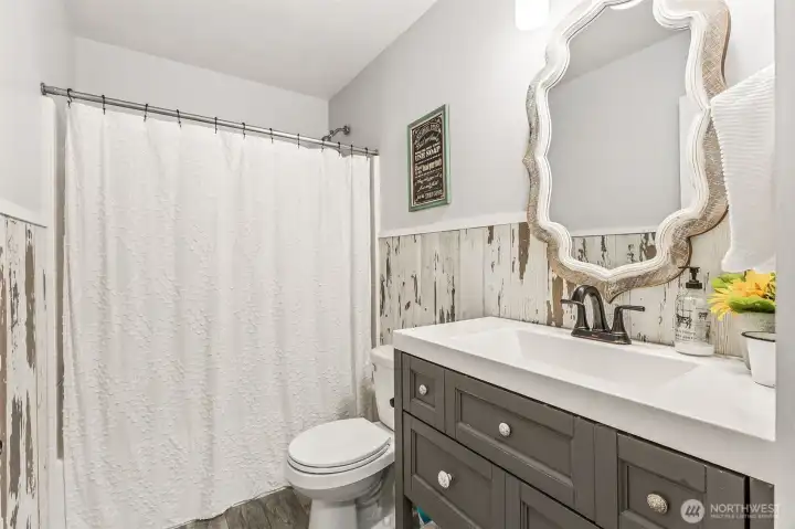 Downstairs full bath with tub/shower combo. Downstairs full bath with tub/shower combo.
