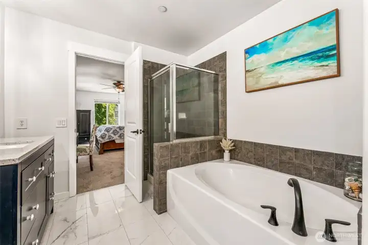 Enjoy a soaking tub with separate shower in the primary bath. Enjoy a soaking tub with separate shower in the primary bath.