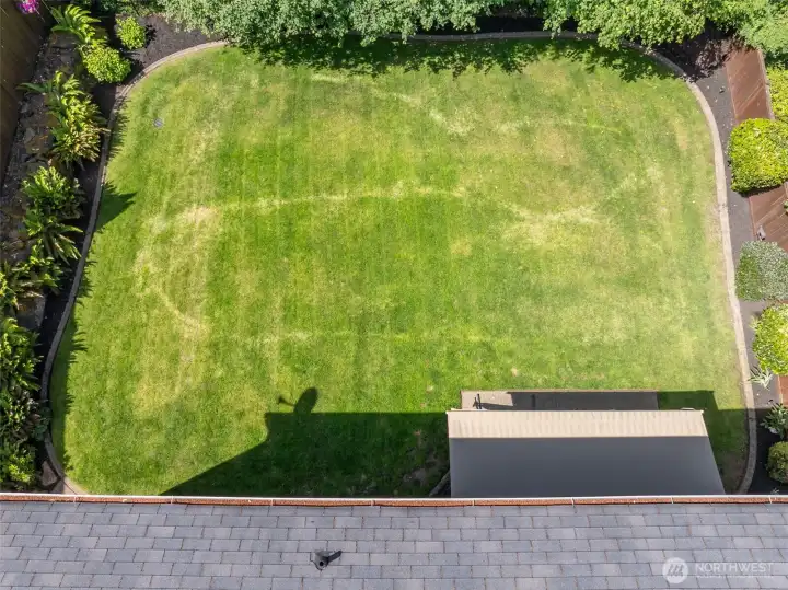 Cement edging and mature landscaping provide a beautiful backyard setting. Retracting awning is located over the patio. Cement edging and mature landscaping provide a beautiful backyard setting. Retracting awning is located over the patio.