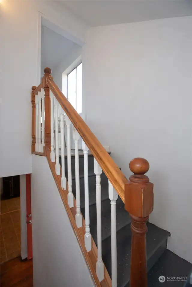 Stairs to upper 2 bedrooms and full bath