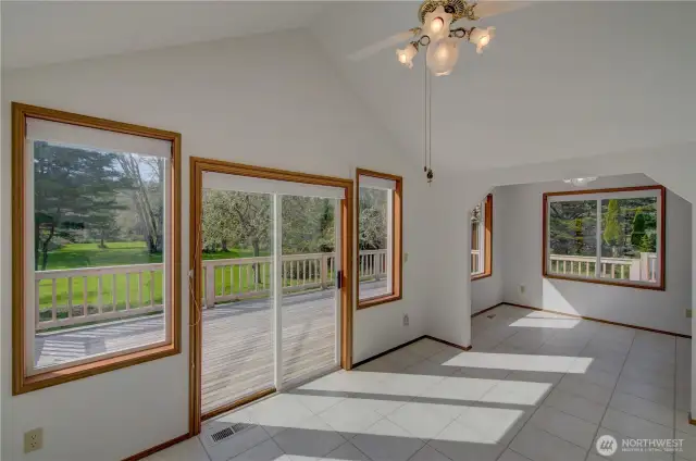 The sun room and breakfast nook with access to the back deck and 4 acre yard.