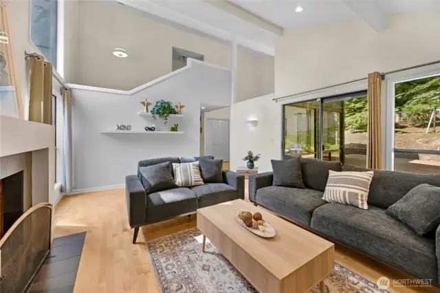 Let the outdoors in through the slider leading to the patio, deck and X-large backyard