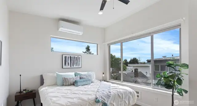 Entire top floor primary with walk-in closet and primary ensuite; large windows facing west and south.