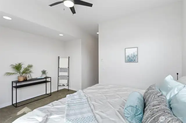 Large primary can accommodate a king bed, dresser and seating area.