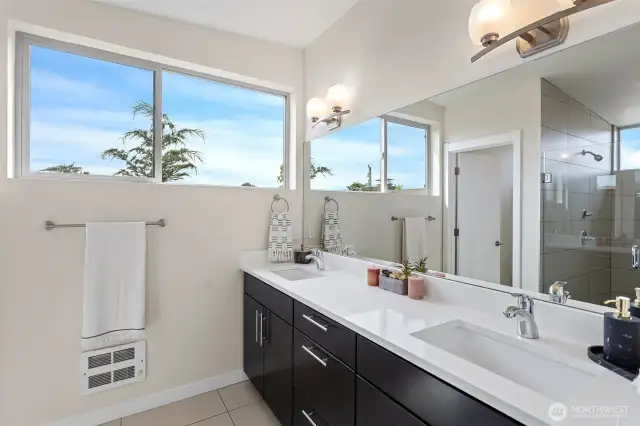Primary Ensuite with large walk-in tiled shower, double vanity with rectangular sinks and separate toilet room.