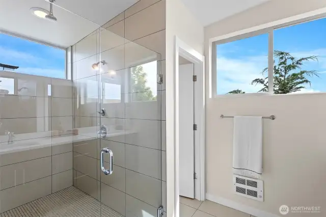 Primary Ensuite with large walk-in tiled shower, double vanity with rectangular sinks and separate toilet room.