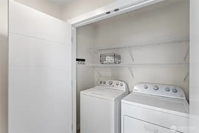 Full sized washer-dryer conveniently situated on primary suite floor