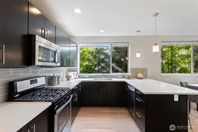 A large kitchen for that chef in you! Large white countertops and large windows create a space to enjoy your creativity.