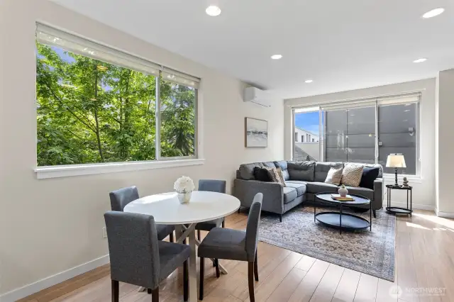 Living Room opens to dining area and kitchen. Abundant light and space!