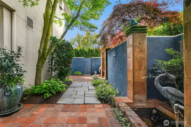Patio off the 2nd floor with water feature.