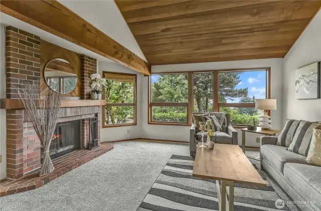 Living room with mountain and lake views