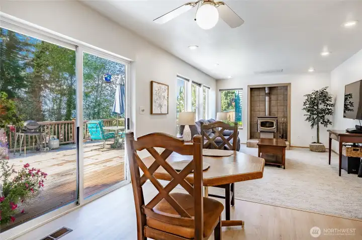 Breakfast nook off kitchen opens to large deck overlooking peaceful and private backyard.