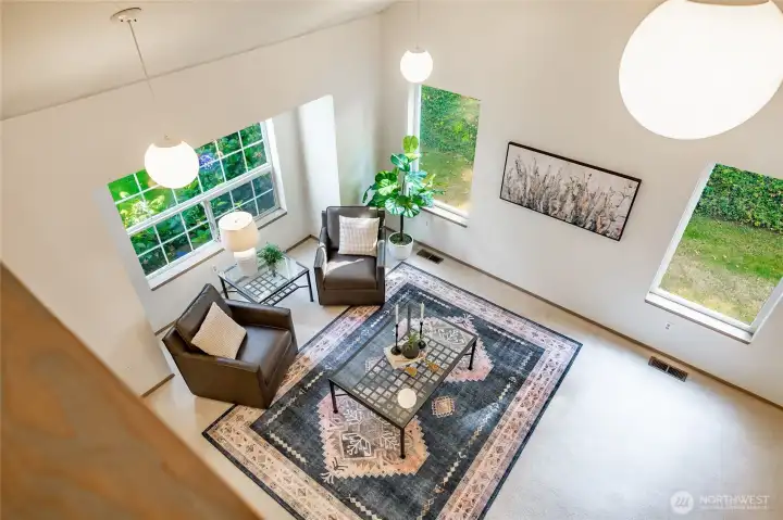 View of living room from banister upstairs