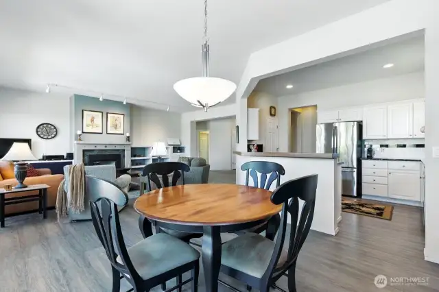 Open floor plan flows to dining area and well-appointed kitchen that invites participation