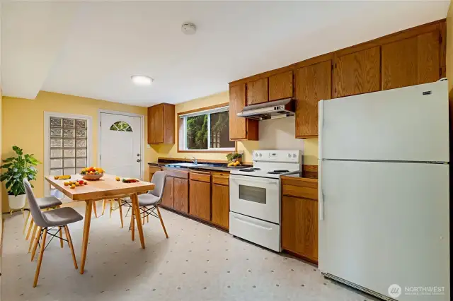 2nd Kitchen on lower level.  You could rent out the lower level with the 2 bedrooms and separate laundry separate entrance (virtually staged)