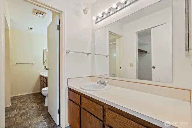 Full Bath - PLUS additional 1/4 bath off primary BR which has 2nd sink and cabinet area adjacent to WIC.