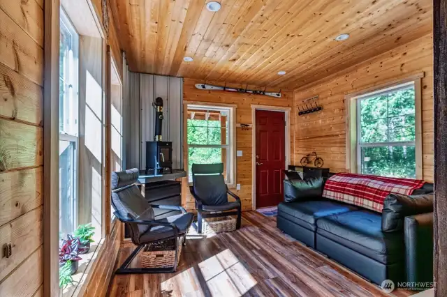 Stunning finishes that elevate the space. LVP flooring and dwarf wood stove.