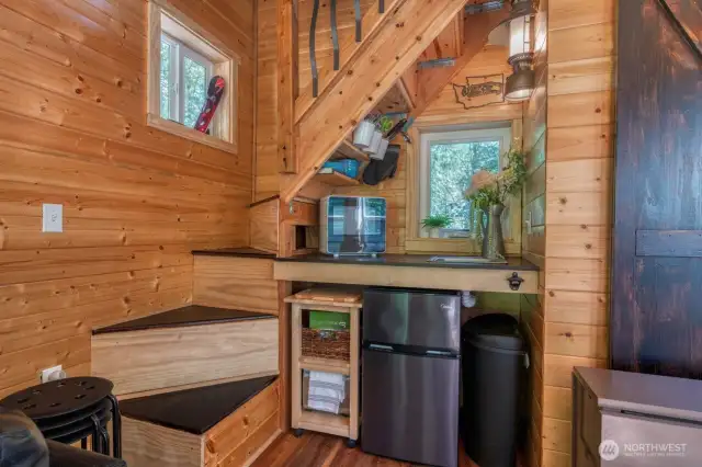 Well-appointed kitchen prep area.  Rustic lighting throughout adds to the cabin charm.