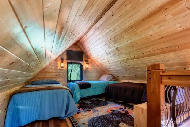 Open loft layout makes room for three beds with ease.  Windows on opposite ends.