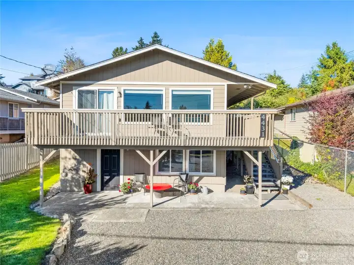 South facing home with wrap around deck and ample parking.