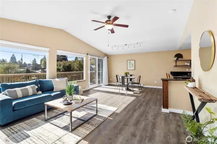 Living room with large south facing windows.
