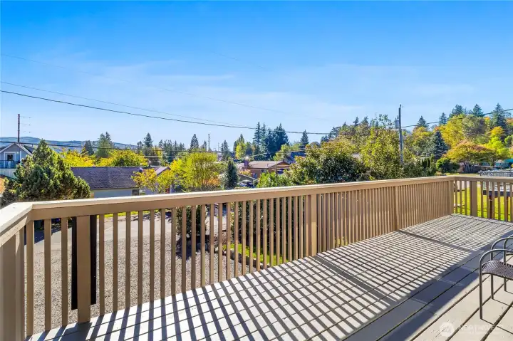 Wrap-around, south facing deck w/ peak-a-boo lake view.